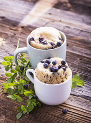 Blueberry Microwave Muffin in mug . Selective focus