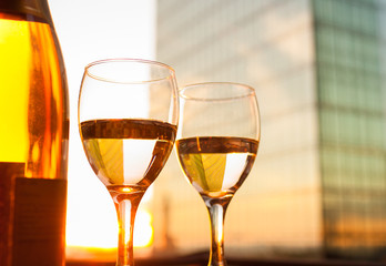 Luxurious dining. Pair of wine glasses in a city restaurant.