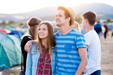 Beautiful young couple at summer tent festival