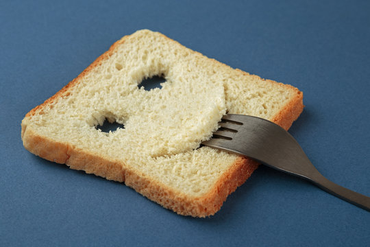 Happy toast with a fork in her mouth