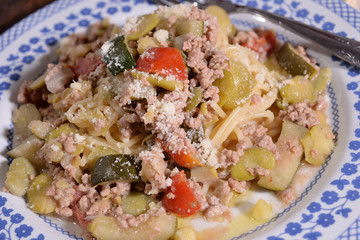 Spaghetti with minced meat zucchini and beans