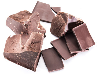 Chocolate blocks and pieces of chocolate bar isolated on a white