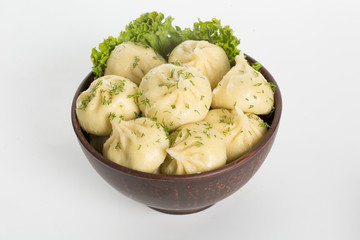 khinkali cooked on a ceramic plate