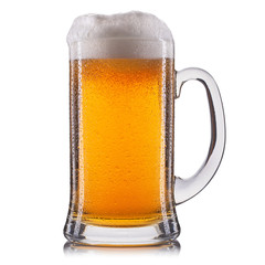 Frosty glass of light beer isolated on a white background.
