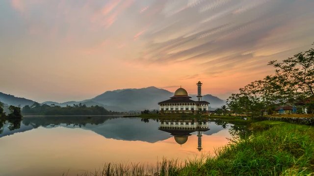 Beautiful Serene Morning At Lakeside Darul Quran Mosque, Selangor, Malaysia.
Time lapse with stacked images creating artistic soft brush stroke effect on the clouds.