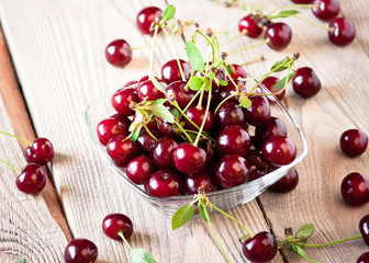 Fresh cherry on wooden table.
