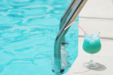 Blue cocktail near pool