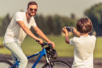 Dad and son cycling