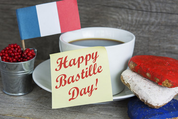 The National Celebration In France La fete nationale (Bastille Day) - text, Heart shaped cookies color red, blue, white. Cup of coffee (tea), france flag, decoration. Patriotic Breakfast Concept.