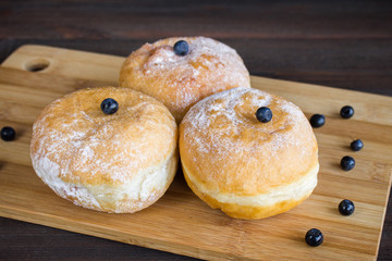 blueberry donuts sprinkled with icing sugar