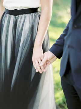 Sweden, Bride and groom holding hands