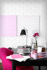 Workplace with laptop on table at home