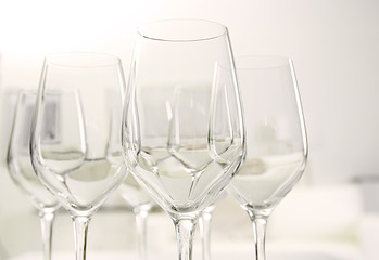 Wineglasses on blurred interior background