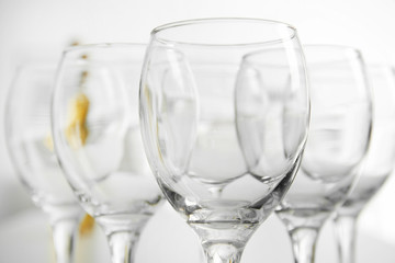 Wineglasses on blurred interior background
