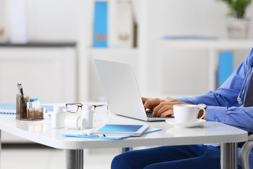Doctor working on a computer in hospital