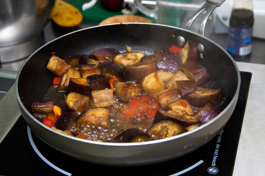 Stew eggplants preparing in the pan