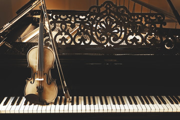 Violin on piano keys, close up