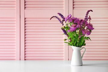 Wild flowers on pink folding screen background
