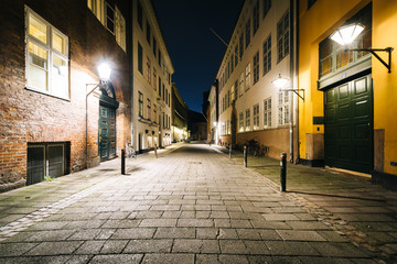 Fototapeta na wymiar A narrow street at night, in Copenhagen, Denmark.