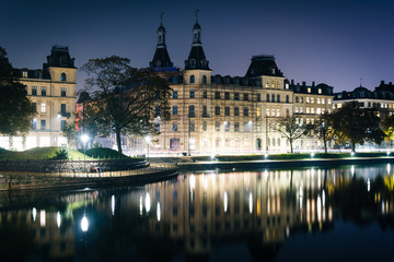 Buildings along Peblinge Sø at night, in Copenhagen, Denmark.