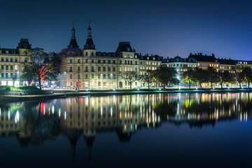 Buildings along Peblinge Sø at night, in Copenhagen, Denmark.