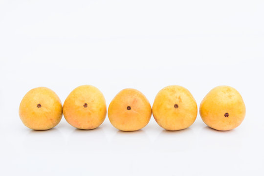 Yellow ramiflora fruit on white background