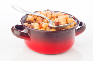 metal pot with chickpea stew with sausage