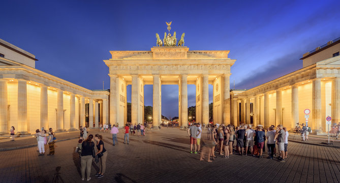 Germany, Berlin, Illuminated Brandenburg Gate and populated square at night - Powered by Adobe
