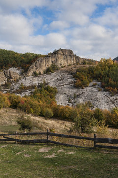Autumn hill with fence