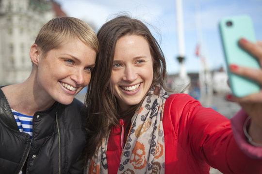 Sweden, Stockholm, Ostermalm, Two women taking selfie