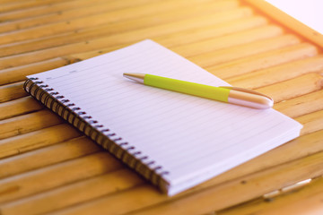 blank open notepad and pen on wood background,office view images by category

