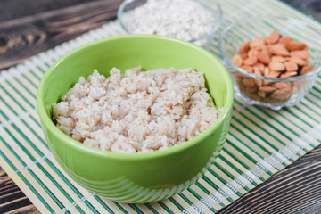 Porridge Oats with Nuts on Wooden Tables