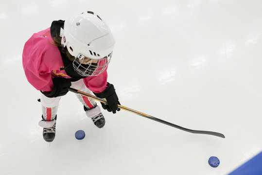 Sweden, Girl (6-7) training on ice hockey rink