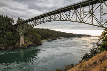 Deception Pass Bridge in Washgton, United States. Taken during a cloudy sunset.