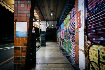 Graffiti and sidewalk in the Zhongzheng District at night, Taipe