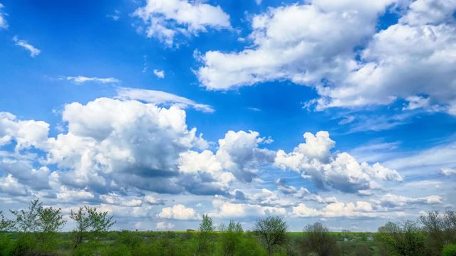 Countryside timelapse. Bright sunny day. Moving clouds from right to left