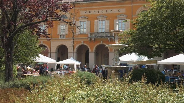 Mortara, Italy &ndash; circa May 2016: Thrift shop in front of town hall
