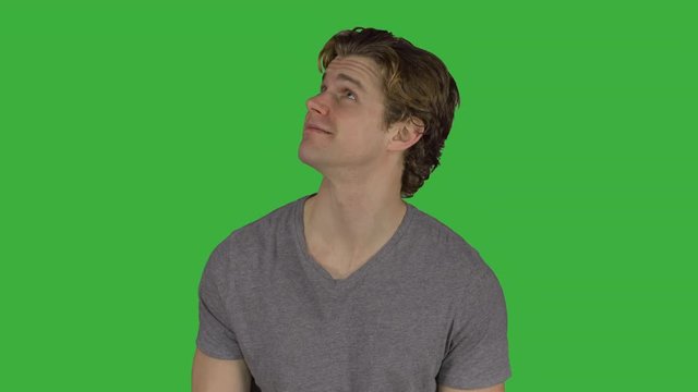 Happy young guy looking all around him (Green Key)