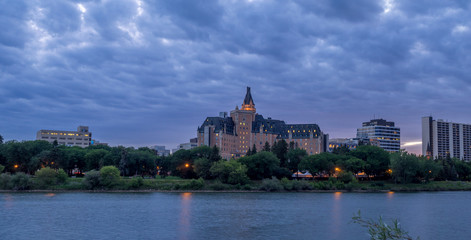 Saskatoon skyline at night along the Saskatchewan River.