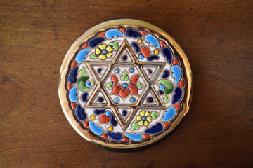 Decorative coaster with golden Jewish Star of David inlay