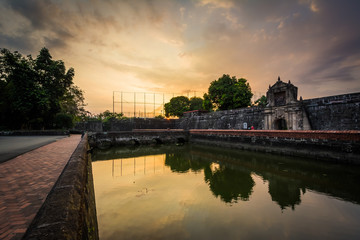 Fototapeta premium The moat at Fort Santiago at sunset, in Intramuros, Manila, The