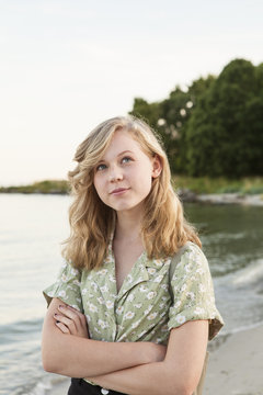 Sweden, Blekinge, Hallevik, Portrait of teenage girl (16-17) standing on beach