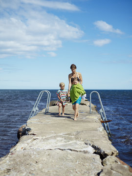 Sweden, Oland, Mother and son and daughter (4-5, 6-7) on pier