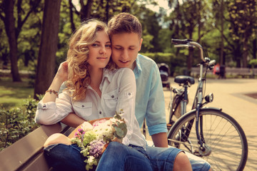 Casual couple in a summer park.