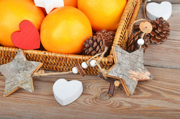 Orange in wickered tray with Christmas decor
