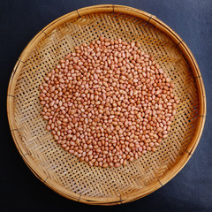 peanut beans with bamboo texture background