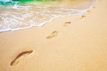 beach, wave and footprints
