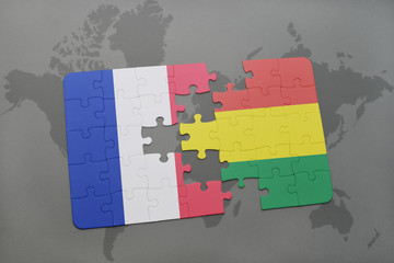 puzzle with the national flag of france and bolivia on a world map background.