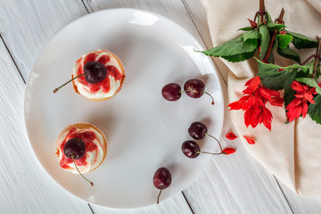 cupcakes with cherries and flowers