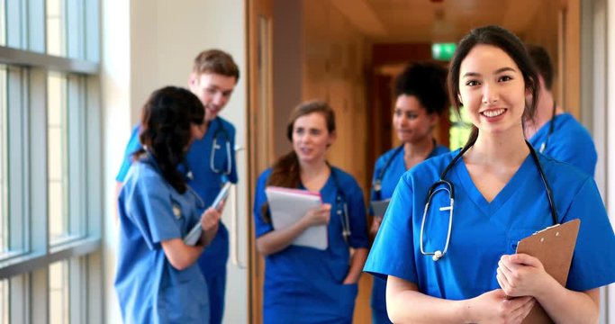 Medical students chatting in hallway in high quality 4k format